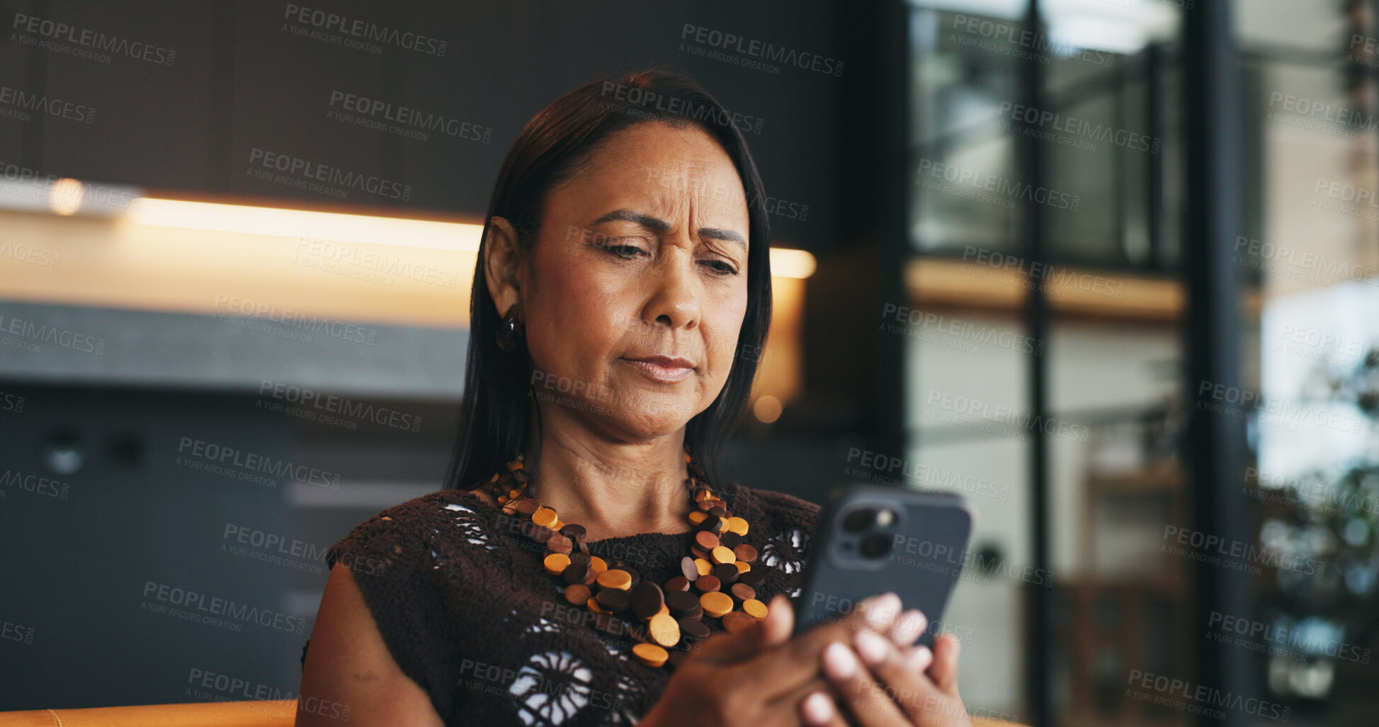 Buy stock photo Confused, woman and reading in home with phone, unexpected news and text message for online gossip. Mature person, doubt and concern in house with tech, mobile chat and update for social media rumor.