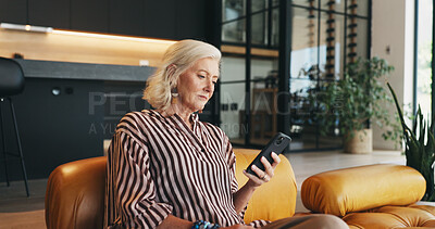 Buy stock photo Phone, relax and senior woman on sofa in home with networking, communication or texting on mobile app. Technology, reading and elderly female person in retirement with cellphone for chatting in house