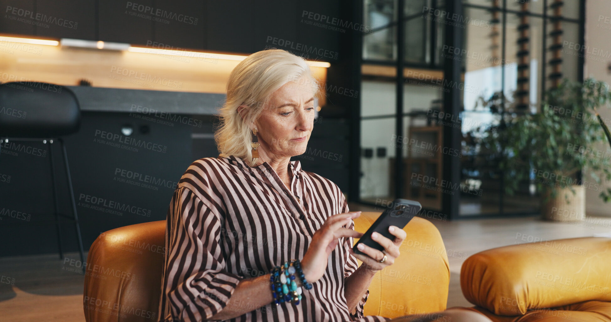 Buy stock photo Woman, scroll and reading in home with phone, website and social media app for digital communication. Mature person, browsing and typing on sofa with tech, text message and search for breaking news.