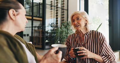 Buy stock photo Coffee, senior women and friends in home for conversation, gossip or bonding together on weekend. Elderly people, talking and relax with tea in living room for catch up, story or advice in retirement