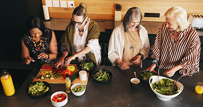 Buy stock photo Home, cooking and women in kitchen, above and ingredients for recipe, discussion and social reunion. Nutrition, friends and mature people with salad, diet plan and preparation for healthy meal