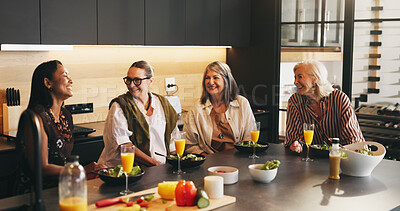 Buy stock photo Mature, happy women or laughing with lunch in kitchen for social gathering, reunion or start. Vegan group, female people or funny joke with humor, salad or orange juice for afternoon get together