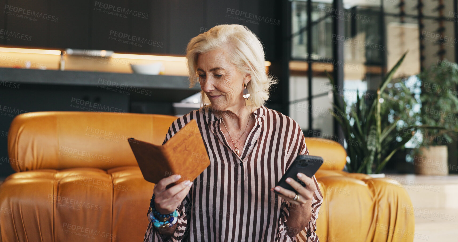 Buy stock photo Woman, reading and phone in home with passport for booking flight, VISA application or travel planning. Mature person, check ID or document with tech, website and registration for international trip.