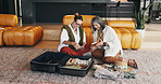 Mature, happy women and packing with suitcase in home for holiday, vacation or getaway together. Female people, friends or travel in preparation with luggage, passport or flight ticket for schedule