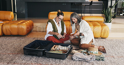 Buy stock photo Mature, happy women and packing with suitcase in home for holiday, vacation or getaway together. Female people, friends or travel in preparation with luggage, passport or flight ticket for schedule