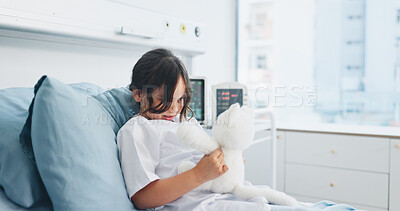 Buy stock photo Teddy bear, healthcare and kid in hospital bed with comfort, support or recovery for surgery. Medical, relax and girl child patient with plush toy for care, healing or wellness in pediatric clinic.