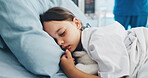 Sick, sleeping and girl in hospital bed for recovery, healthcare and wellness with rest. Patient, tired and child in clinic, nap and treatment for illness, medical service and comfort with fatigue