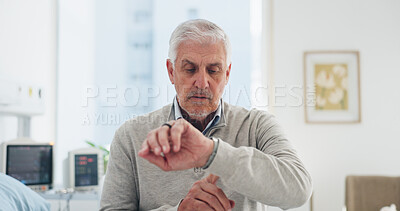 Buy stock photo Medical, time and waiting with man on hospital bed for appointment, checkup or healthcare. Impatient, late and watch with mature patient in medicare clinic for treatment delay, visit or wellness