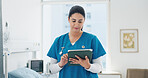 Woman, nurse and tablet in hospital for healthcare schedule, information or review medical history. Technology, person and worker in clinic to scroll email, update report and research on internet