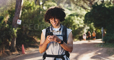 Buy stock photo Hiking, chat or man on path with phone, message alert or location share in summer hobby. Trekking, bokeh or male person in forest with tech, notification check or journey update on social media.