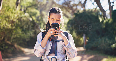Buy stock photo Phone, reading and woman in nature for hiking, navigation and guide in path direction. Travel, bokeh and female person in forest with tech, map tracking and location search on outdoor adventure.
