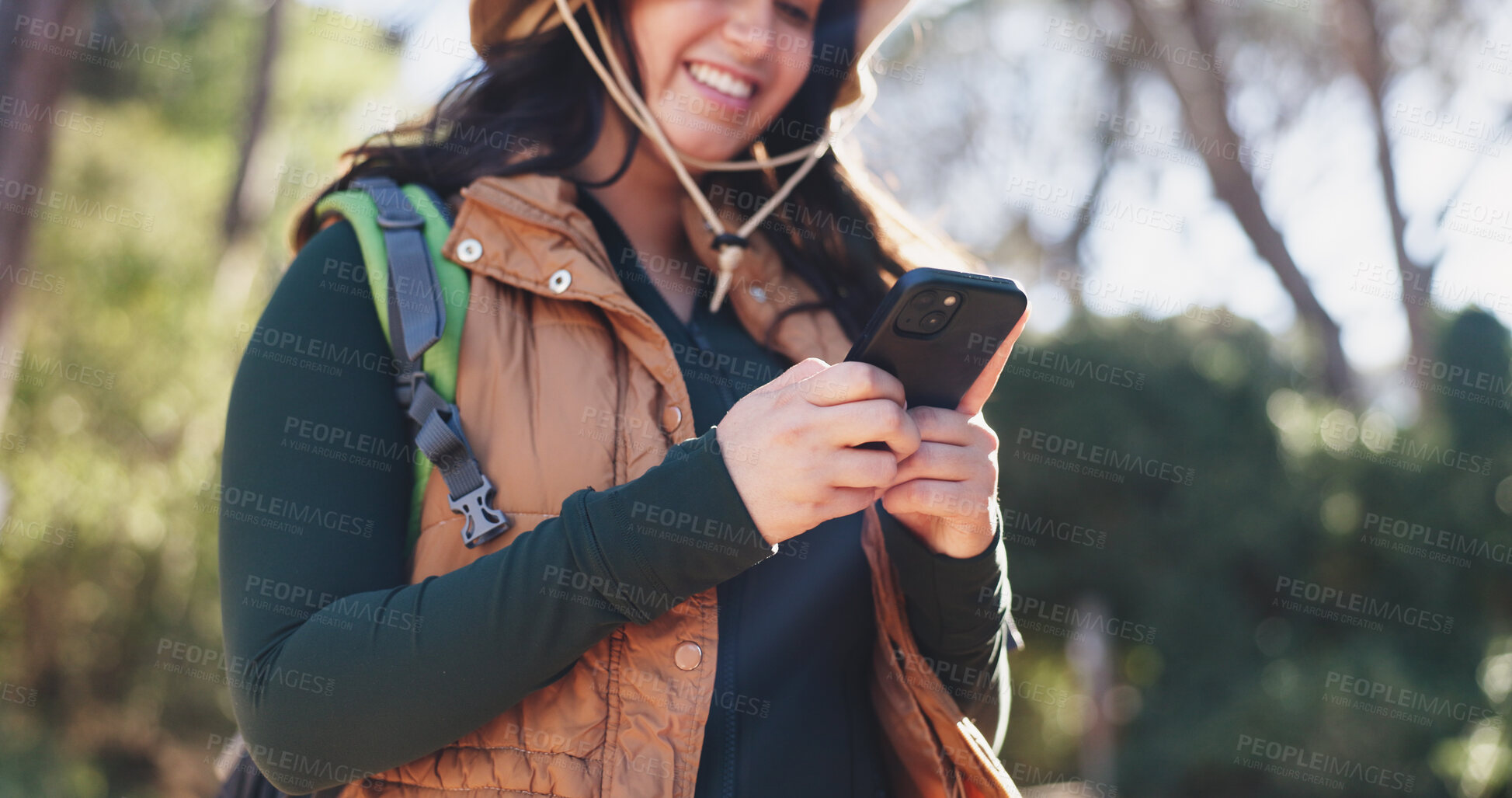Buy stock photo Hiking, low angle or woman in nature with phone, message alert or location share in summer hobby. Trekking, bokeh or person on path with tech, notification check or journey update on social media.