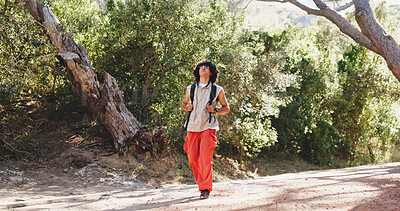 Buy stock photo Thinking, man and hiking for fitness in woods with smile, adventure and sightseeing on holiday. Person, walking and backpacking with reflection, trekking view and explore nature on vacation in forest