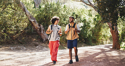 Buy stock photo Backpacking, hiking and travel with male friends outdoor in forest for hobby or journey. Conversation, trekking and walking with hiker men on trail in nature together for adventure or bonding