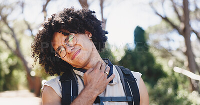 Buy stock photo Backpacking, man and hurt with neck pain, forest and adventure with muscle strain in nature or trip. Hiking, accident and person with injury, hiker and massage for joint tension in woods and outdoor