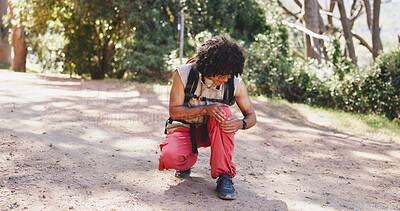 Buy stock photo Man, hiking and stress in nature with knee pain, leg injury and joint sprain on path. Person, backpacking or crouch in forest with inflammation, exercise burnout and massage to relieve muscle tension