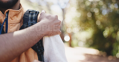 Buy stock photo Hand, hiking and man in woods, shoulder pain and muscle tension with inflammation. Outdoor, hiker and person with exercise, joint injury and wellness with ache, strain and travel with health risk