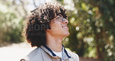 Buy stock photo Man, smile and thinking with hiking in forest for holiday adventure, inspiration and getaway. Person, happy and glasses for view in woods for reflection, break or sightseeing for trekking in summer