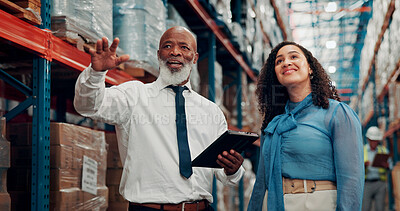 Buy stock photo Supervisor, pointing and people with tablet, logistics and explaining distribution schedule or talk. Warehouse, supply chain and goods inspection with woman, quality control and mature man with tech