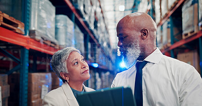 Buy stock photo Warehouse, meeting and people with tablet, logistics and checking stock distribution schedule on web. Flare, mature man and woman with tech for delivery update, shipping and collaboration in factory