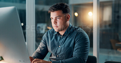 Buy stock photo Office, man and typing on computer at night for story draft, editing article or publication deadline. Journalist, person or tech at publishing agency for breaking news coverage or newsletter research