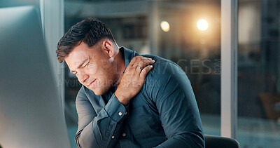 Buy stock photo Tired, computer and shoulder pain with business man in office for night, fatigue and report deadline. Overtime, bokeh and burnout with person in agency for online research, injury and workaholic