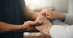 Caregiver, holding hands and comfort with senior person in home for empathy, support and medical results. Nurse, console and elderly patient for care, healthcare diagnosis and assisted living in home