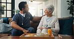 Nurse, man and senior woman with breakfast on sofa for conversation, support or nutrition at house. People, caregiver and smile on couch with elderly patient, assisted living and food at nursing home