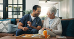 Nurse, man and old woman with breakfast on sofa for conversation, support or nutrition at house. People, caregiver and smile on couch with elderly patient, assisted living and food at nursing home