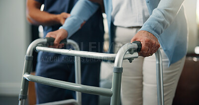 Buy stock photo Person, hands and senior patient with walker for assisted living, balance or mobility in home. Closeup, caregiver or nurse helping elderly with walking aid for steps, physiotherapy or muscle recovery