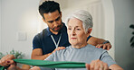 Senior woman, band and physiotherapist in home for strength training, mobility and recovery. Elderly person, physio and help with physical therapy, guidance and healthcare support for rehabilitation