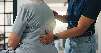 Buy stock photo Hands, person and back pain with physiotherapist in home for assessment, spine injury and recovery. Patient, physio and checkup for physical therapy, healthcare exam and evaluation for rehabilitation