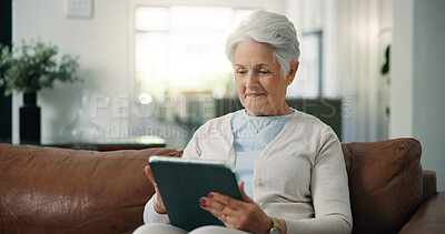 Buy stock photo Tablet, reading and senior woman on sofa in home with online blog, social media or headlines. Smile, digital technology and elderly female person with app for news in living room with relax at house.
