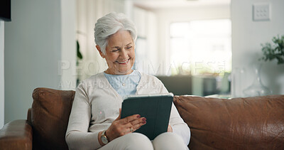 Buy stock photo Tablet, happy and senior woman on sofa in home with online blog, social media or headlines. Reading, digital technology and elderly female person with app for news in living room with relax at house.