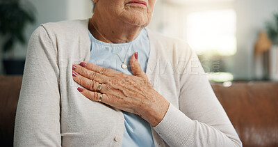 Buy stock photo Chest pain, sofa and hand of senior woman in home with discomfort, heartburn or asthma symptoms. Hypertension, medical emergency and elderly female person with cardiac arrest in living room at house.