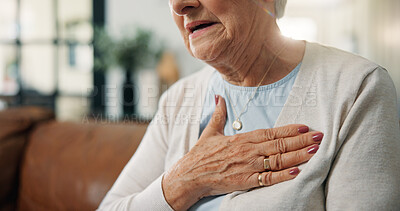 Buy stock photo Chest pain, heartburn and hand of senior woman in home with discomfort, angina or asthma symptoms. Hypertension, medical emergency and elderly person with cardiac arrest in living room at house.