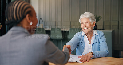 Buy stock photo Shaking hands, deal and senior woman with financial advisor in home for  discussion on retirement fund. Handshake, documents and elderly female person with investor for finance agreement in house.