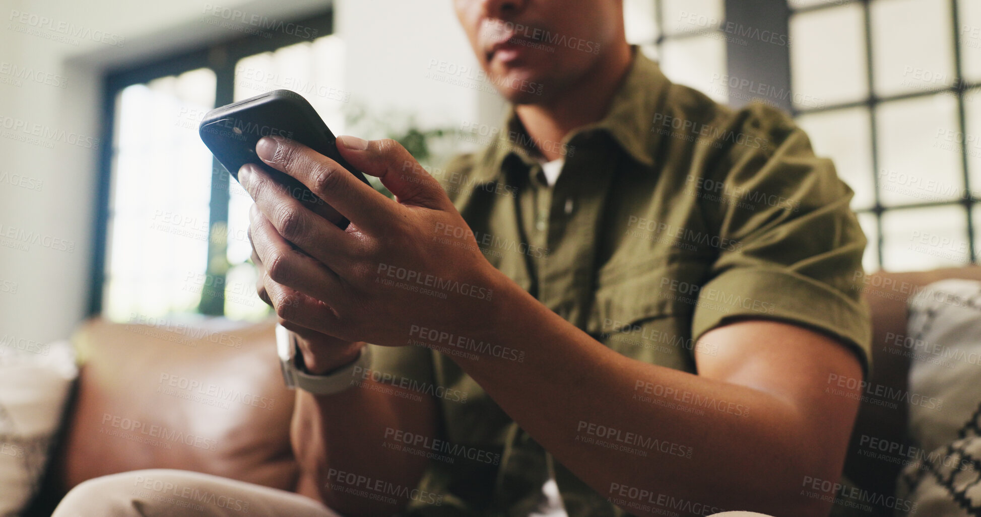 Buy stock photo Hands, home and man on sofa, smartphone and message to contact, relax and online reading. Apartment, email and person on couch, cellphone and digital app for social media, internet and communication