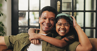 Buy stock photo Father, kid and hug portrait on sofa for bonding together, healthy relationship or security. Happy family, dad or girl child with embrace in home for connection, support or affection on weekend break