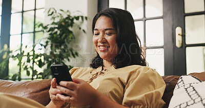 Buy stock photo Happy, house and woman on couch, cellphone and message to contact, relax and online reading. Smile, email and person on sofa, smartphone and digital app for social media, internet and website info