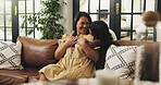 Smile, mama and hug child on sofa in home for connection, love and care with daughter. Mom, girl and embrace in living room for bonding together, family support and trust with parent on mothers day