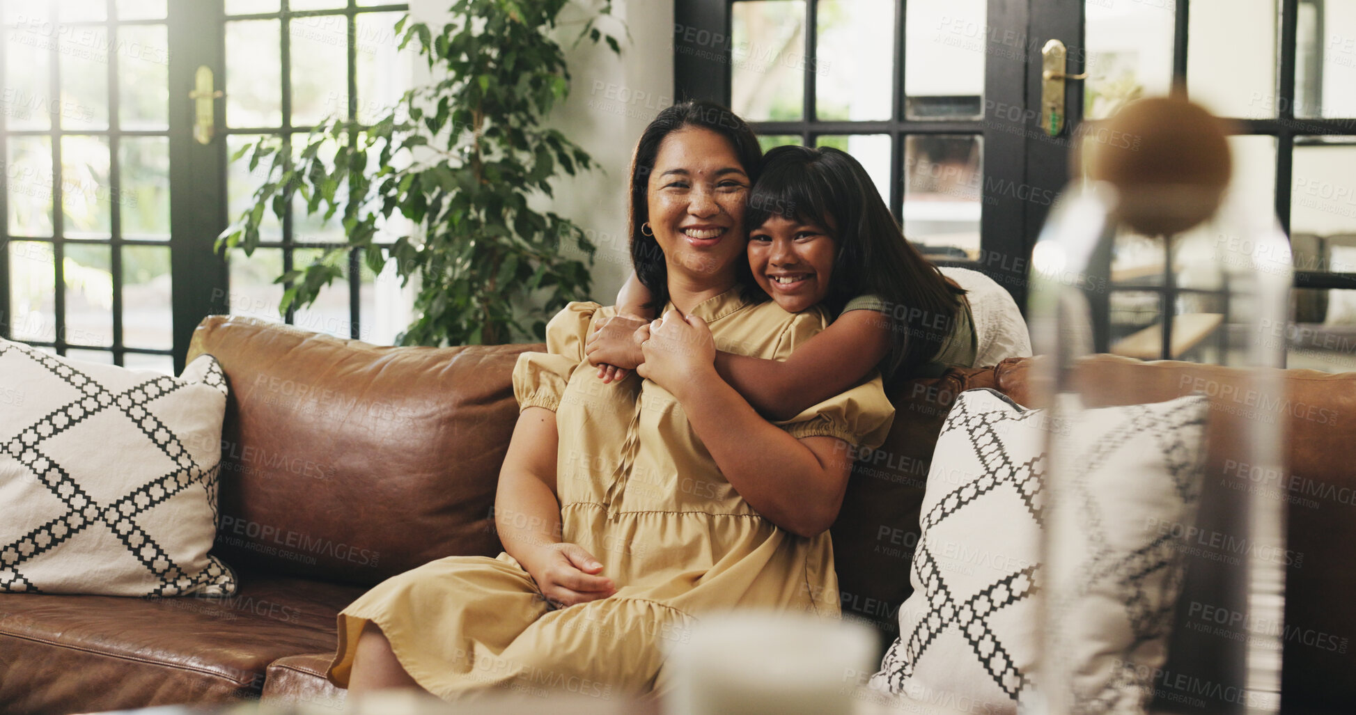 Buy stock photo Portrait, mama and hug child on sofa in home for connection, love and care with daughter. Mom, girl and embrace in living room for bonding together, family support or smile with parent on mothers day
