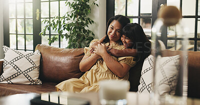 Buy stock photo Love, mama and hug kid on sofa in home for connection, trust and care with daughter. Mom, girl and embrace in living room for bonding together, family support or smile with parent on mothers day