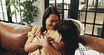 Love, mother and hug kid on sofa in home for connection, trust and relax with daughter. Mom, girl and embrace in living room for bonding together, family support and smile with parent for care