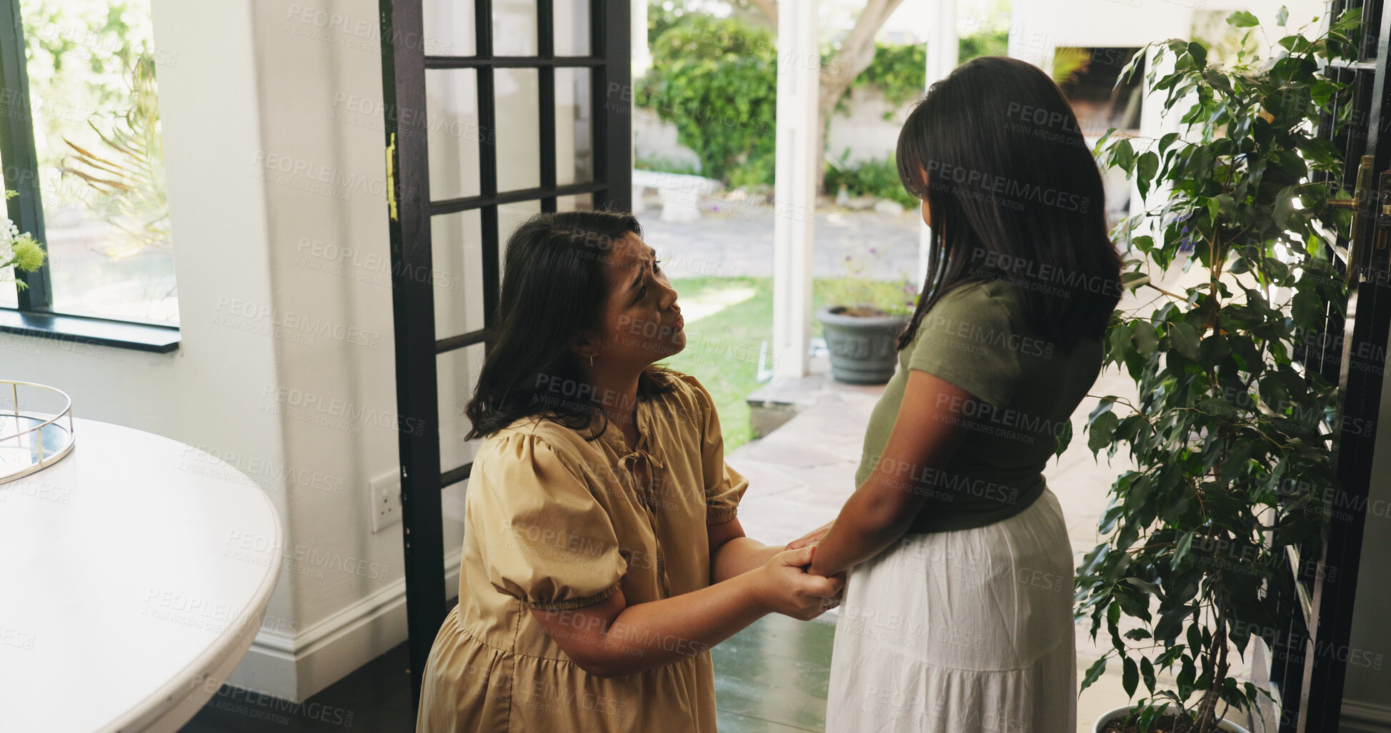 Buy stock photo Holding hands, child and mother with comfort in home for emotional support, reassurance or love. Family, mom and kid with talking in house for trust, advice or healthy relationship with understanding