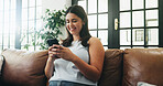 Woman, phone and smile on sofa with texting, communication or typing in home. Girl, tech and contact in living room with connection, social media update or weekend planning on couch with networking