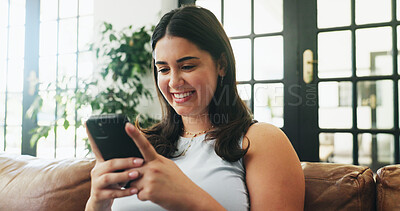 Buy stock photo Girl, phone and smile on sofa with texting, communication or typing in home. Student, tech and contact in living room with connection, social media update or weekend planning on couch with networking