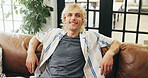 Happy, relax and portrait of man on sofa for resting, comfortable and chill on weekend in home. Apartment, smile and person on couch for me time, break and holiday with positivity in living room