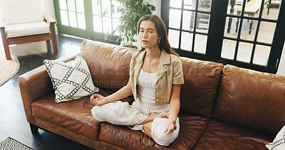 Buy stock photo Woman, yoga and meditation on sofa with lotus, mindfulness and breathing exercise in home. Person, zen and mudra on couch with holistic fitness, wellness and above in living room at apartment