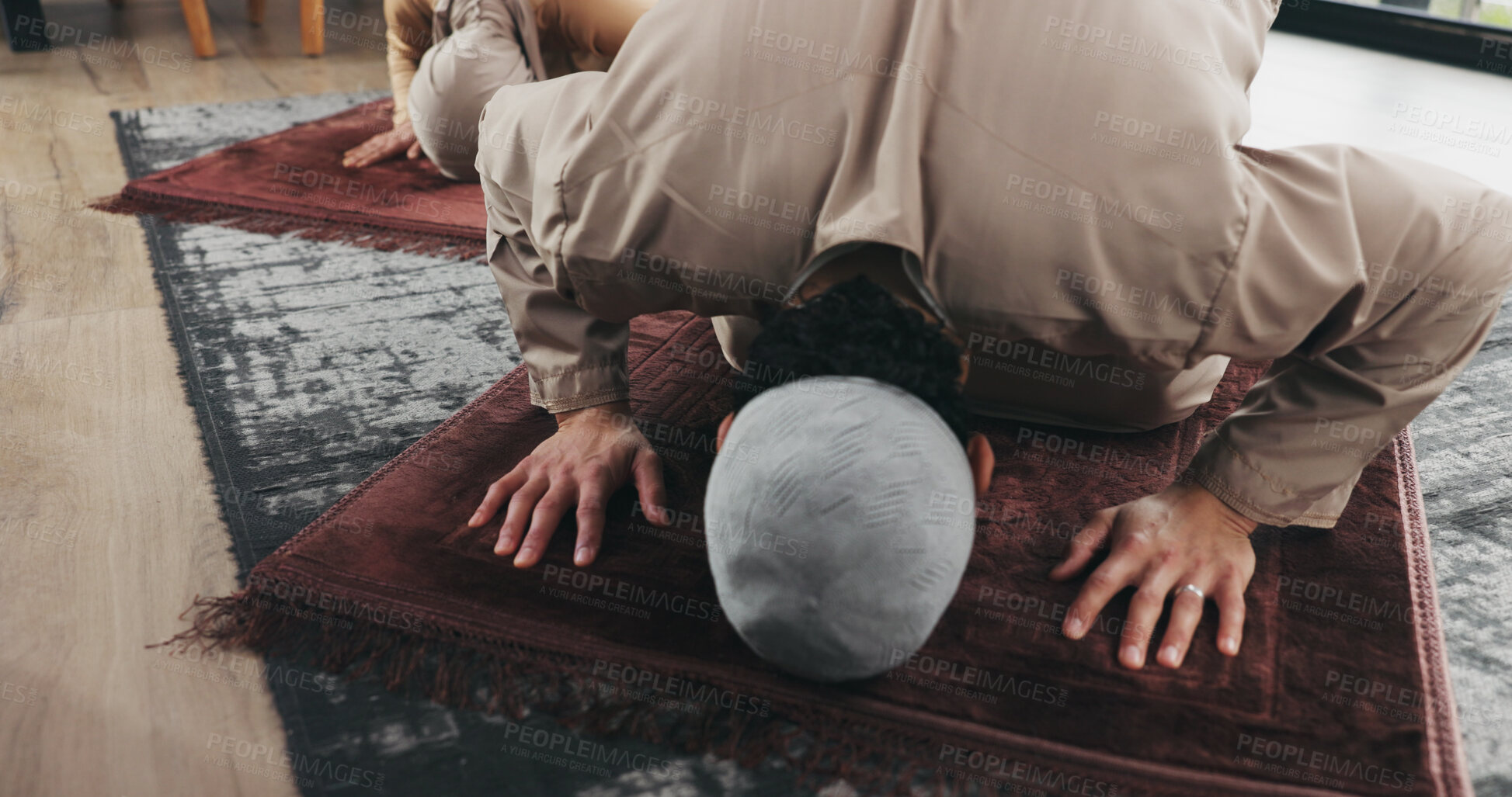 Buy stock photo Muslim couple, home and prayer with bow for faith, religion or praise for Ramadan Kareem. Islam, man and woman praying to worship God with spiritual devotion, salah and gratitude for Allah in house